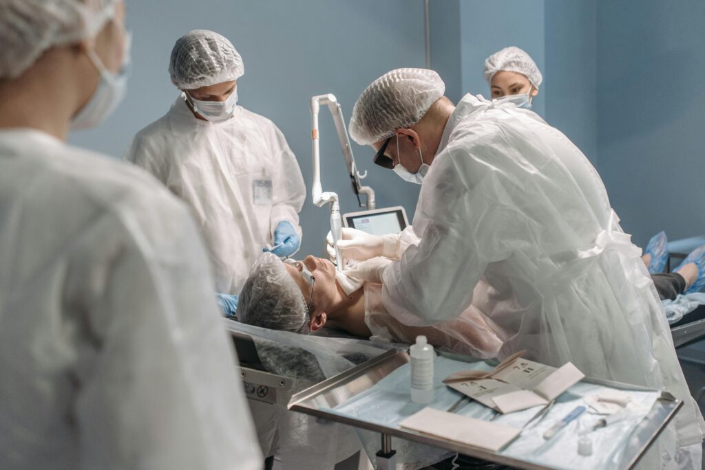 Team of surgeons conducting surgery with precision in a modern operating room setting.